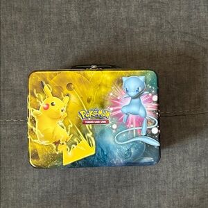 Pokemon Tin with Pikachu in Yellow and Mew in Blue with cards